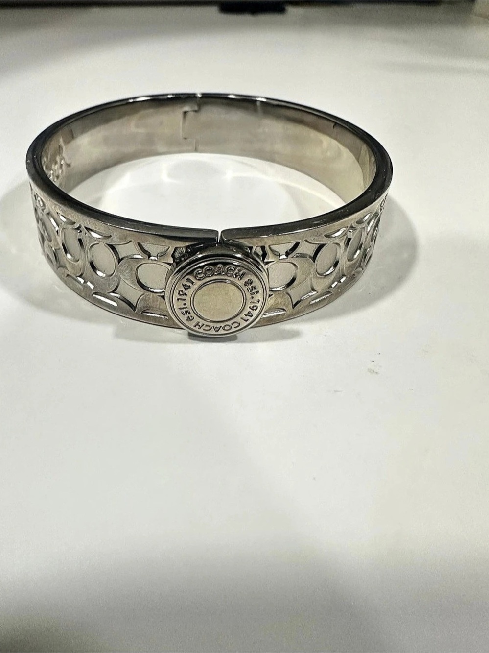 Coach Signature Cutout Hinge Bangle Bracelet Silver